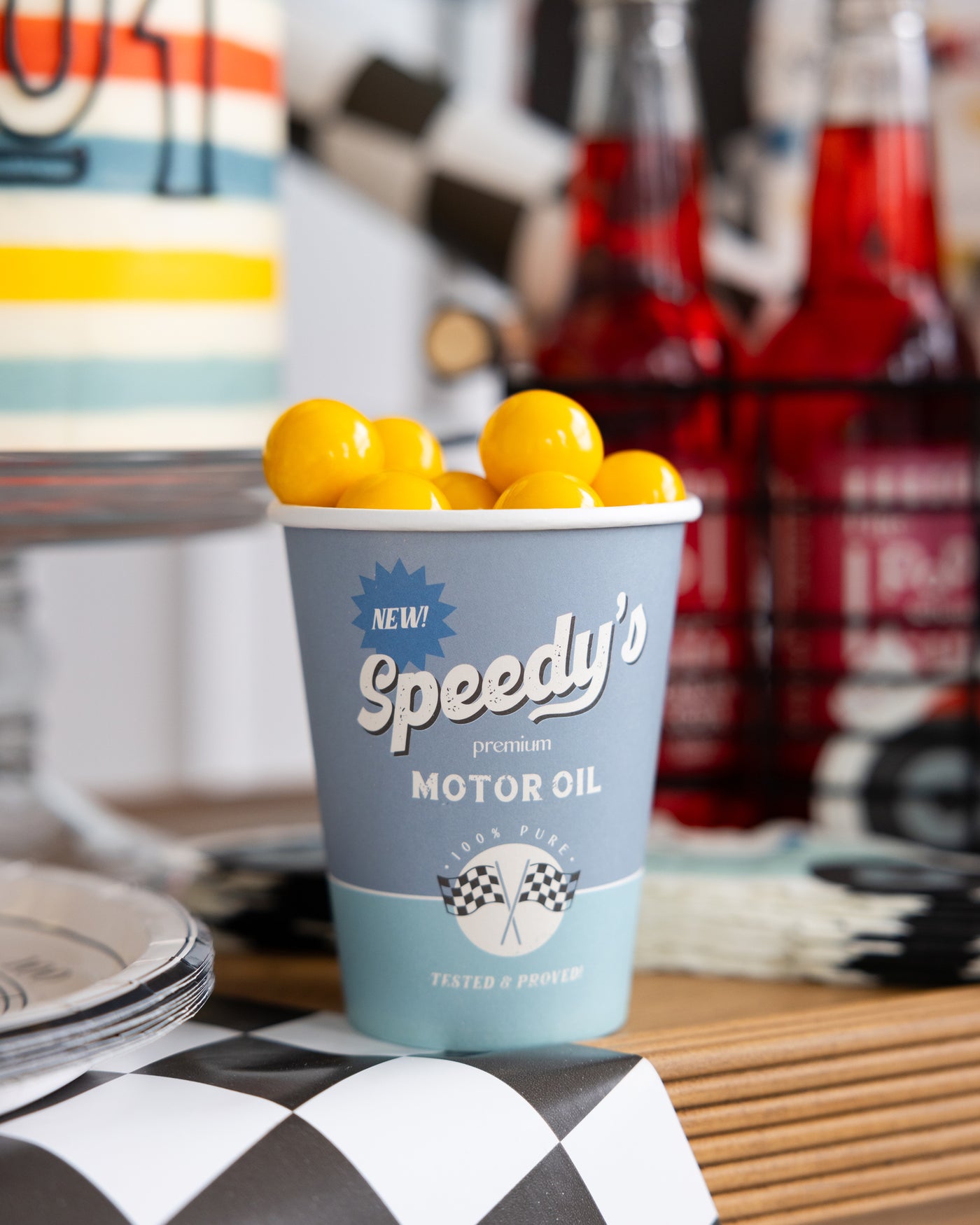 Race car-themed party food including motor oil cups and checkered sandwiches