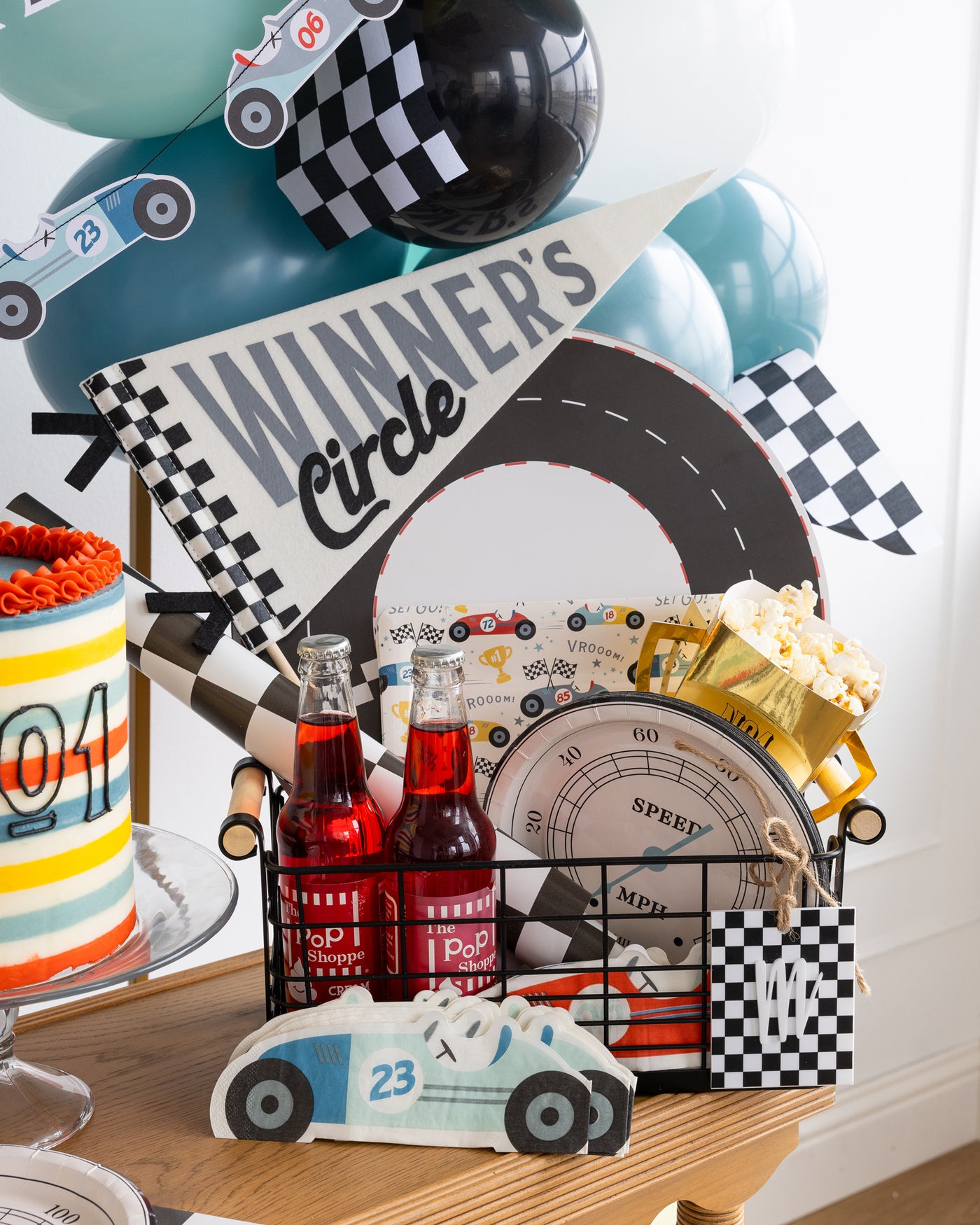 Race car Occasions Bin showing a display of decorations including a cute winner's circle pennant paper plates and placemats