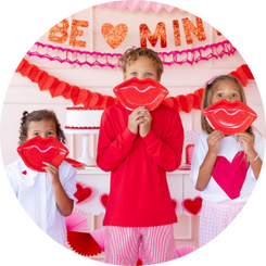 Scattered hearts, XOXO banners, lips, & bold pops of pink