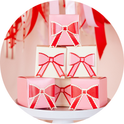 Playful ribbons, soft pastels, & delicate bow details